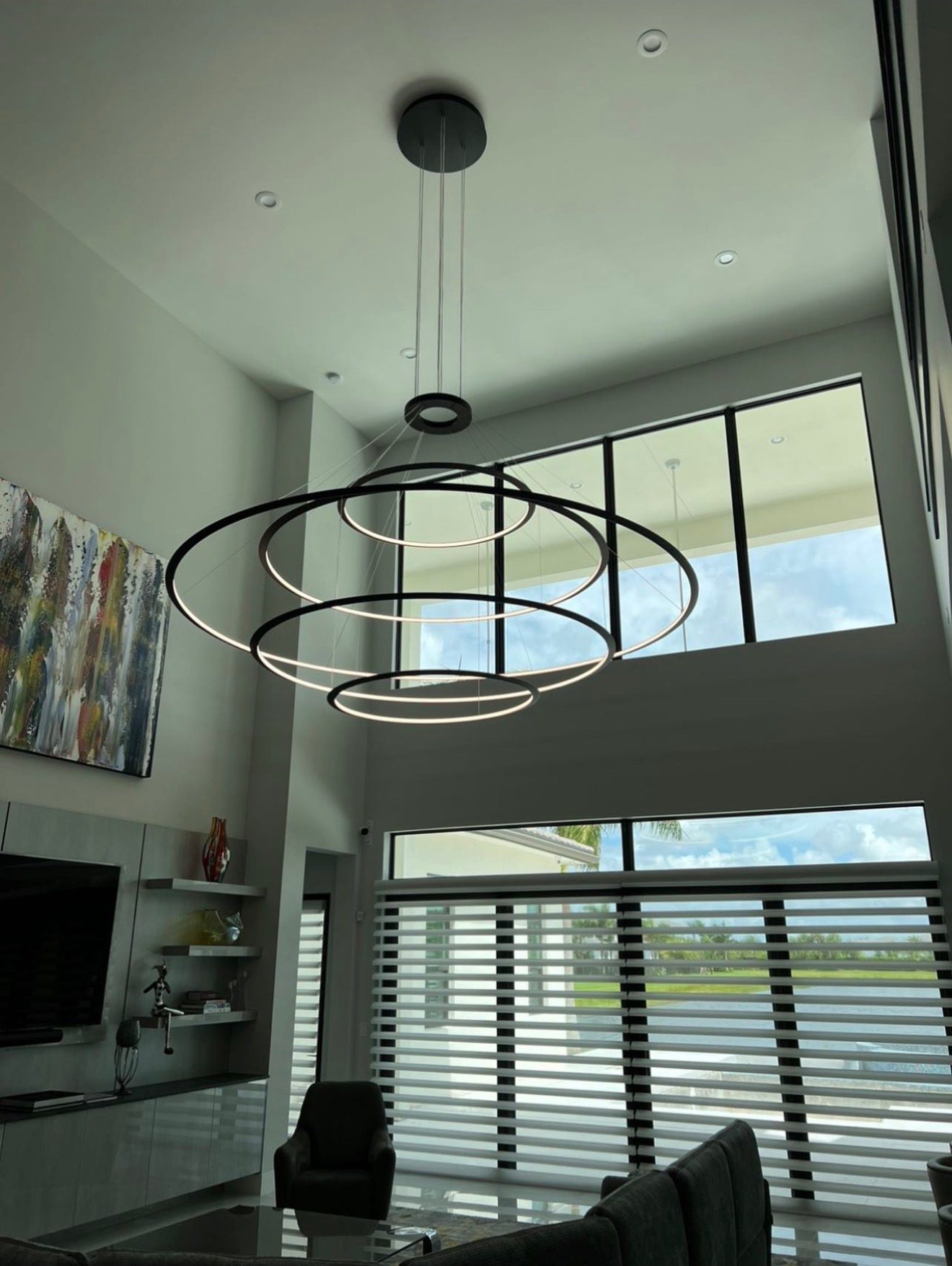 Tiered LED ring chandelier installation